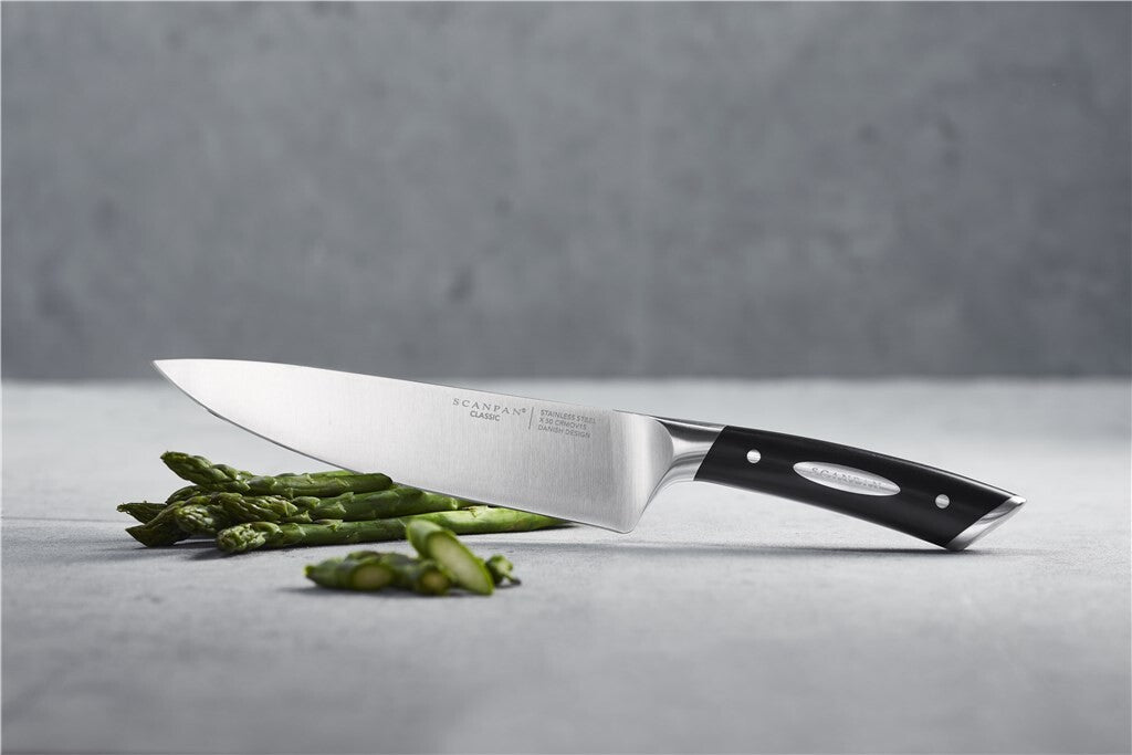 SCANPAN Classic chef’s knife in use during cooking