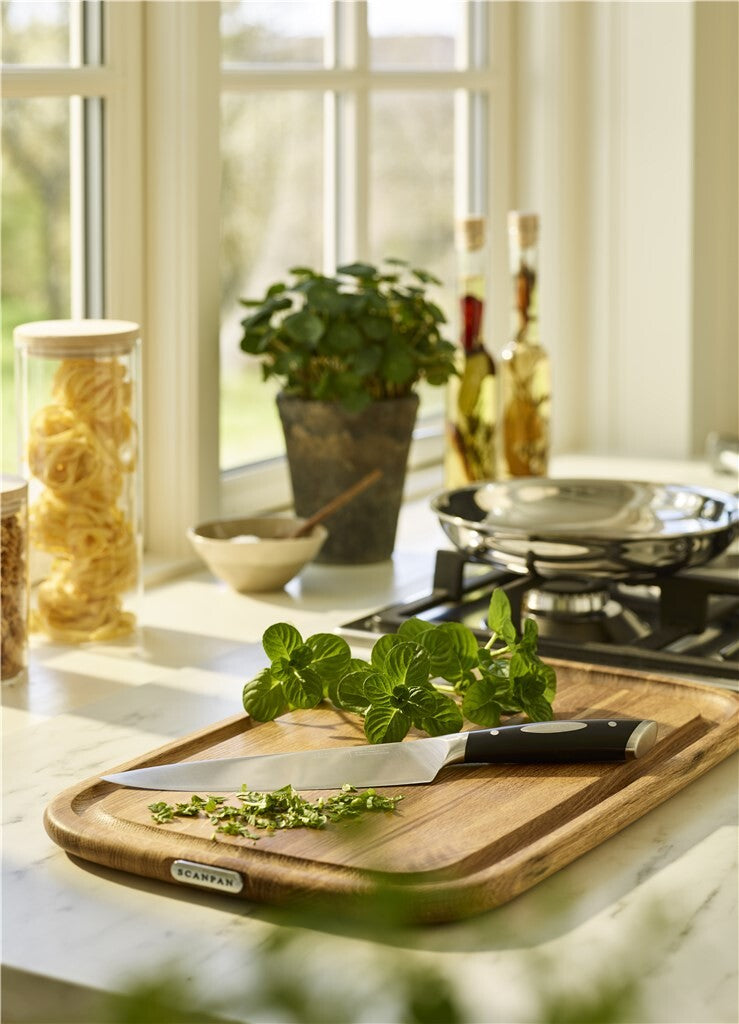 SCANPAN Classic chef’s knife shown with ingredients