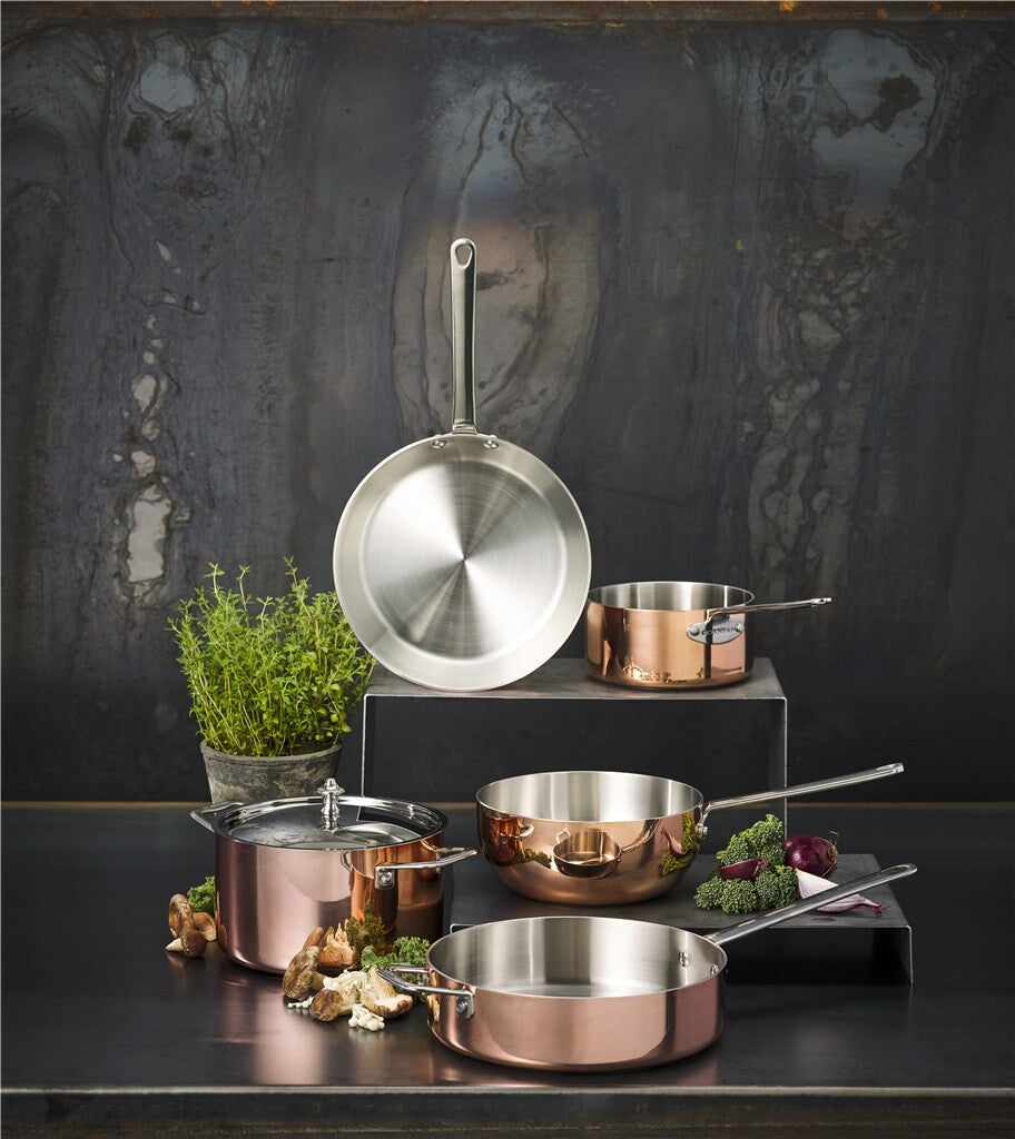 SCANPAN Maitre D' Induction collection with sauté pan on a dark kitchen counter