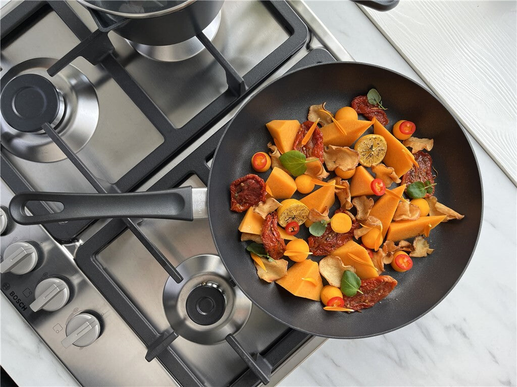Classic and Classic Induction 28 cm frying pans in anniversary editions shown together