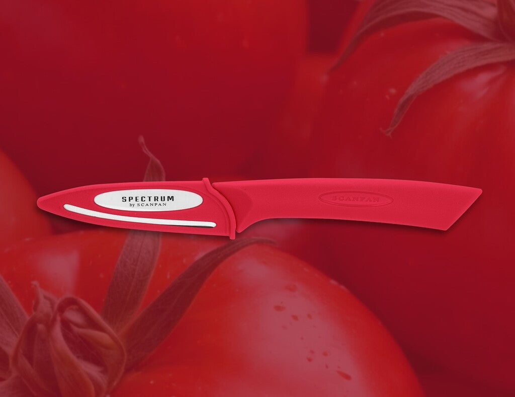 Spectrum paring knife 8 cm in Red shown in use
