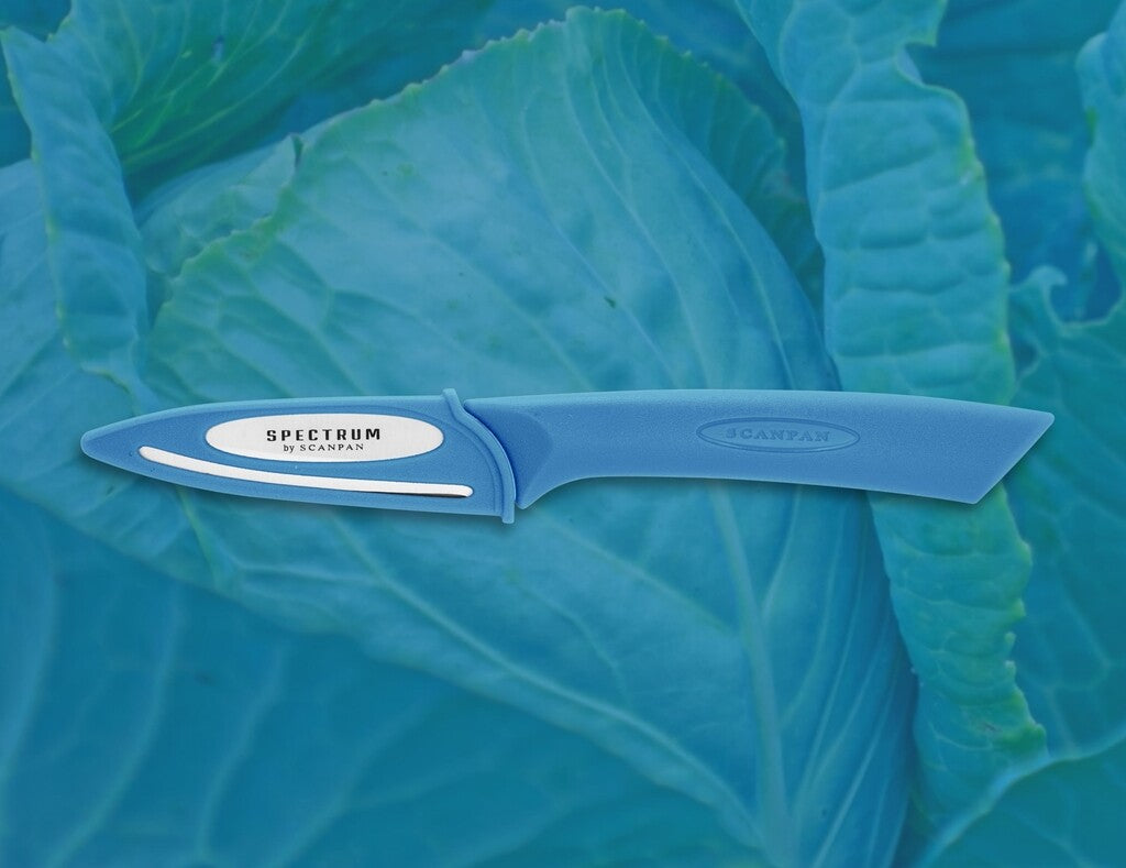 Spectrum paring knife 8 cm in Silver Lake Blue shown in use
