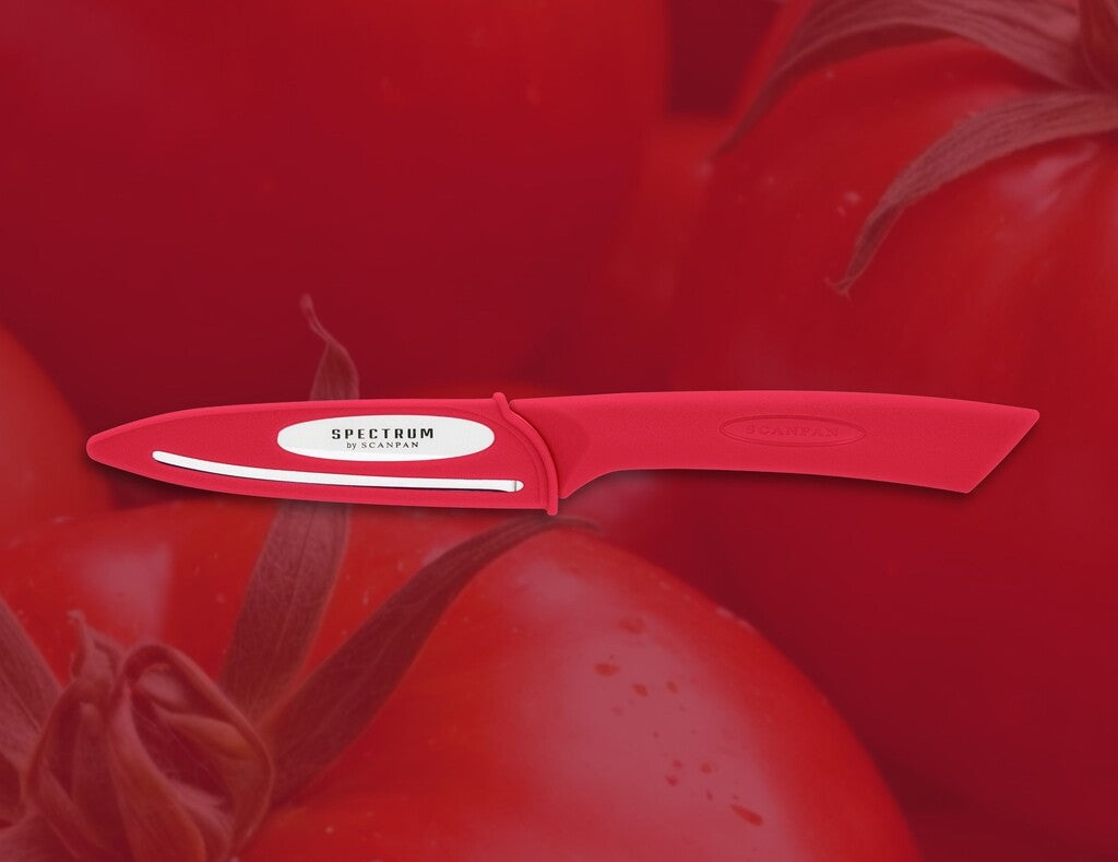 Spectrum vegetable knife in Red shown in use