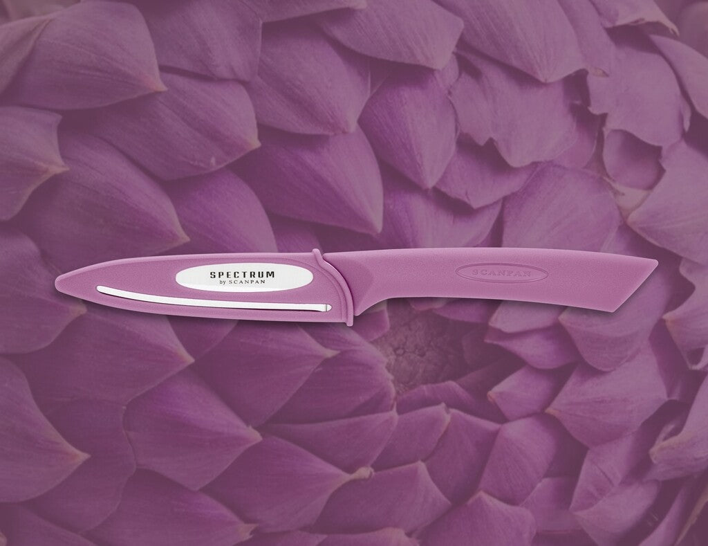 Spectrum vegetable knife in Dusty Lavender shown in use