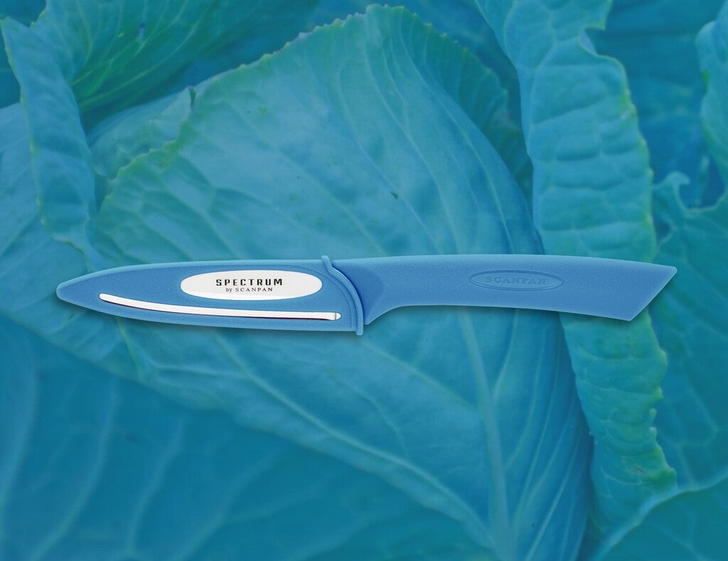 Spectrum vegetable knife in Silver Lake Blue shown in use