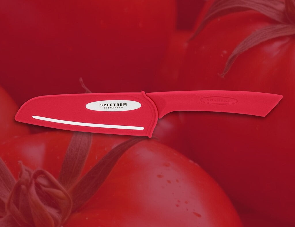 Spectrum santoku knife in Red shown in use