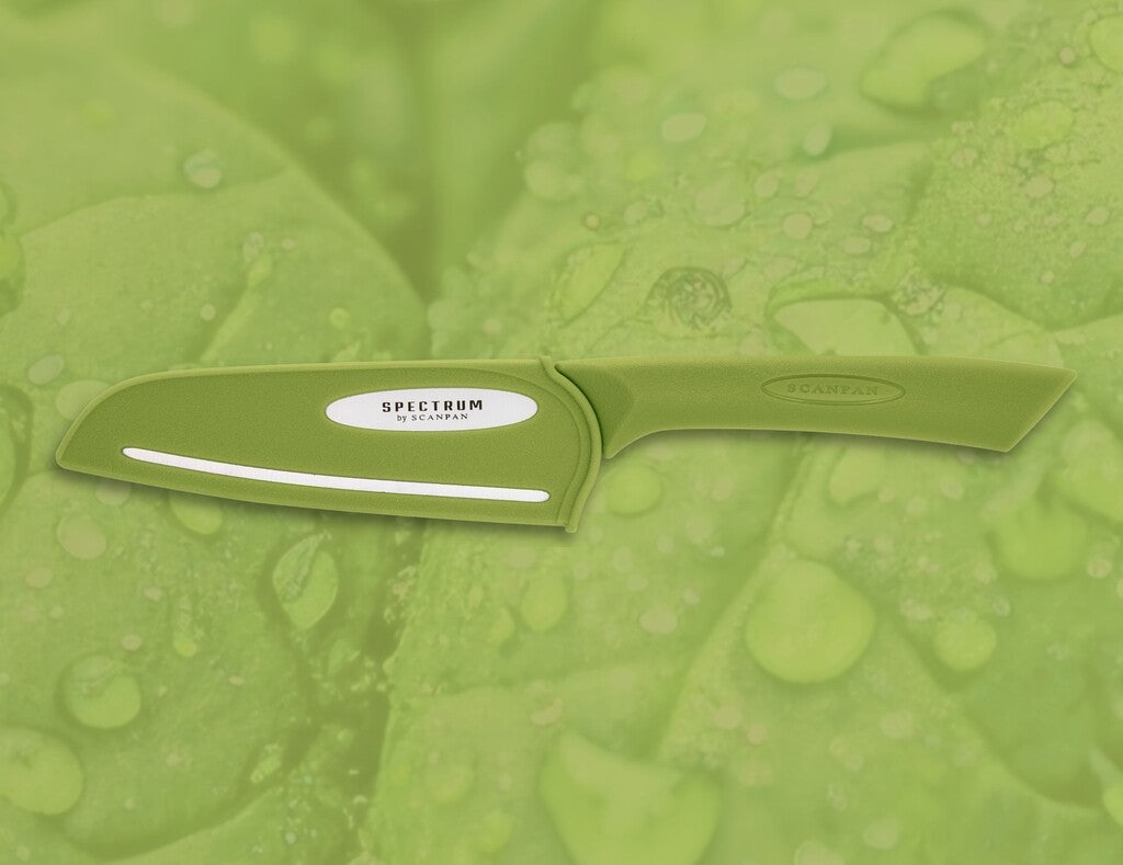 Spectrum santoku knife in Spinach Green shown in use