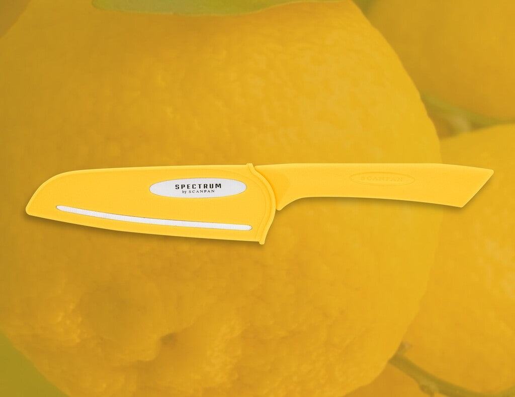 Spectrum santoku knife in Sunstruck shown in use