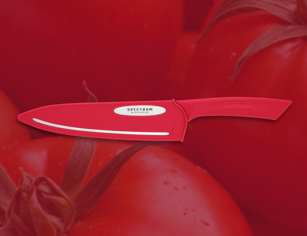 Spectrum chef's knife in Red shown in use