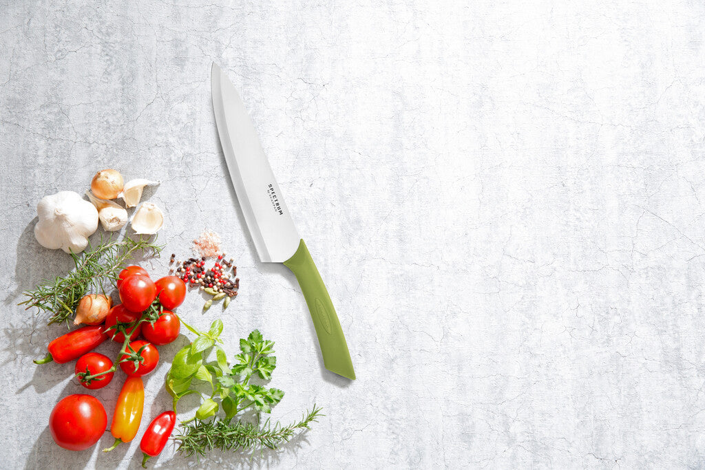 Spectrum chef's knife in Spinach Green shown in use