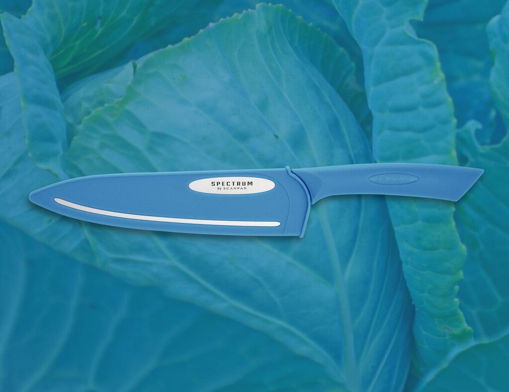 Spectrum chef's knife in Silver Lake Blue shown in use