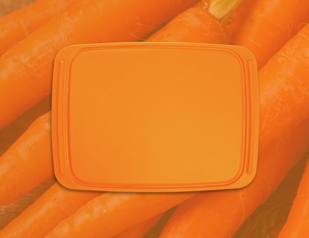 Spectrum chopping board 36 × 26 cm in Carrot Curl on a white background