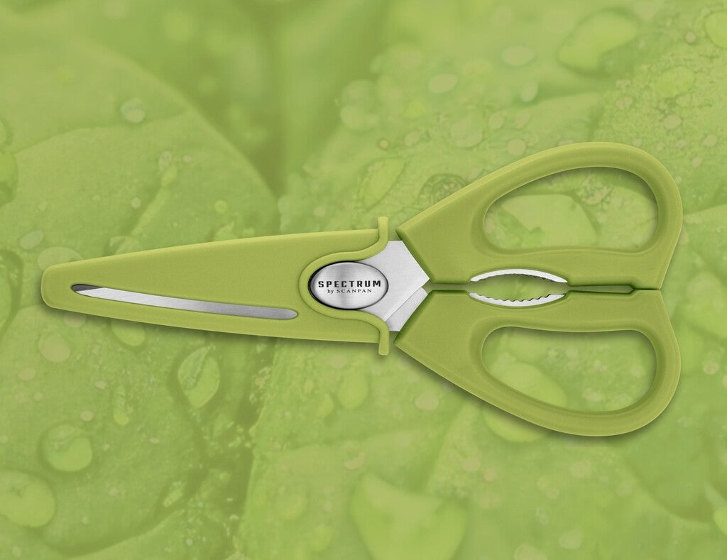Spectrum kitchen scissors in Spinach Green shown in use